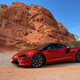 Front quarter view of 2023 McLaren Artura in Burnt Orange.